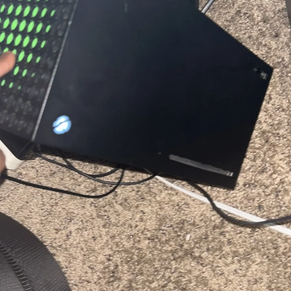 Black Gaming Console with Green Accents